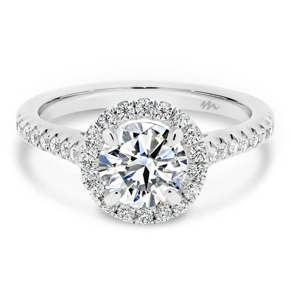 Delta 6.5-7.0 halo Moissanite engagement ring with sparkling accnets on the band.