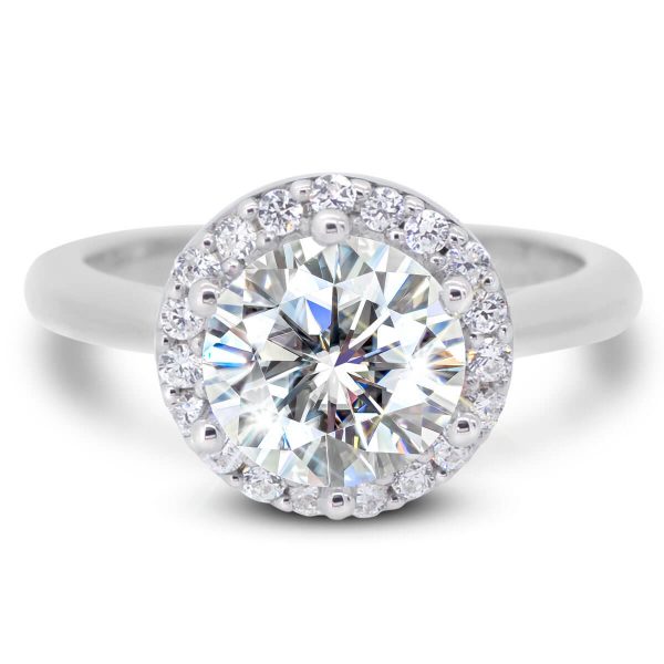 Demi 7.5-8.0 Halo engagement ring with a plain band.