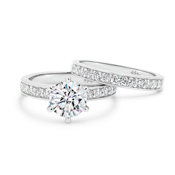 Isabelle 6.5-7.0 Round Moissanite ring with pave-set band