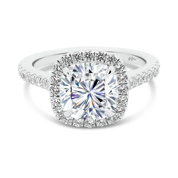 May 7.5-8.0 Cushion halo engagement ring with stones all over the bridge and band.