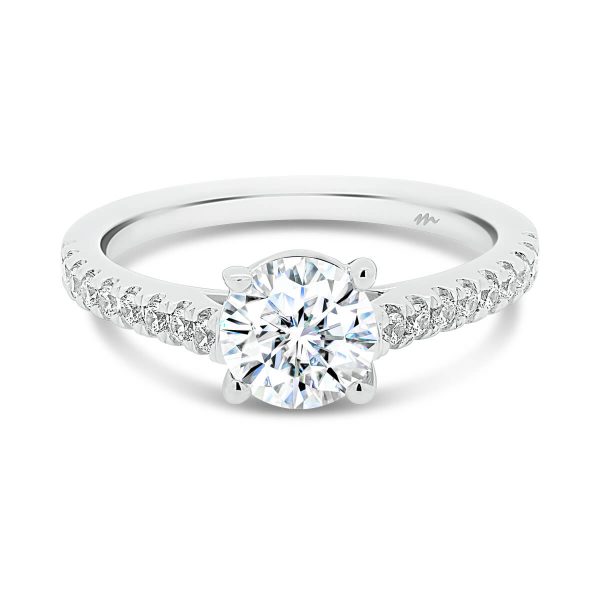 Nouvelle 6.5-7.0 Moissanite ring with a crossover prongs and a thin prong set band.