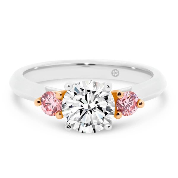 Lawnton Pink 4 prong trilogy ring with two 0.10ct side stones on a fine knife-edge band