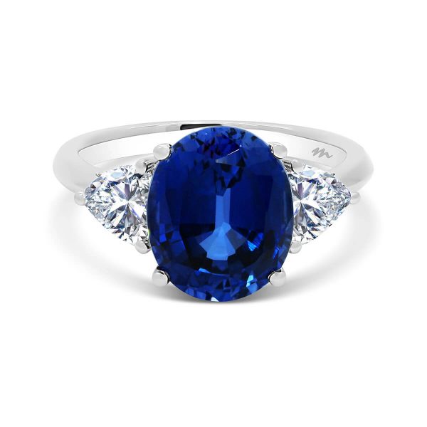 Bluebell sapphire trilogy with two trillion cut moissanite side stone on plain band