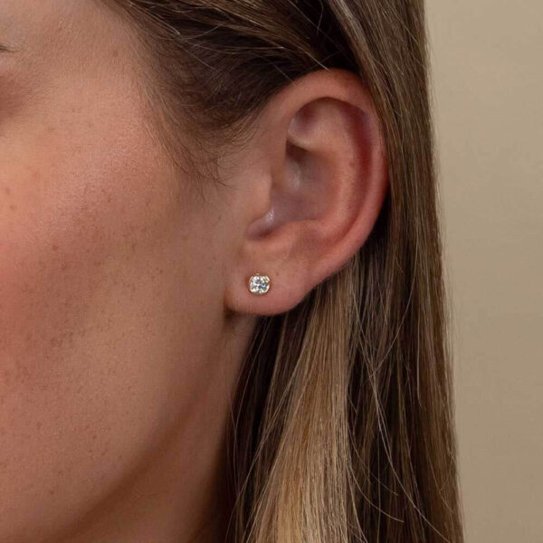 Model Wears Anna 0.25Ct Yellow Gold Lab Grown Diamond Bezel Studs Cropped