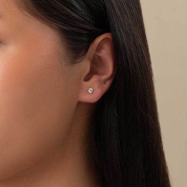 Model Wears Mara 0.16Ct Round Lab Grown Diamond 3 Prong Yellow Gold Studs Cropped