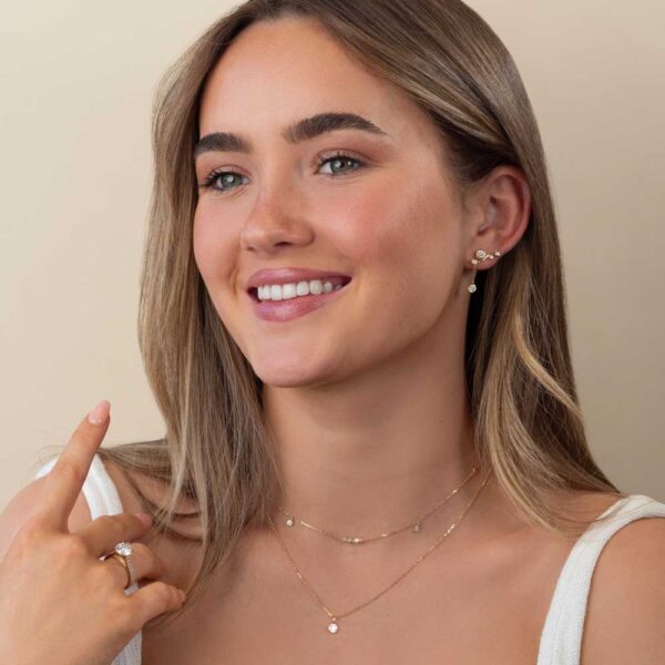 Model Wears Bezel Diamond Anna Studs Gia Round Ear Climber Enhancer Lou Round Charm Cherie Yellow Gold Layer Necklace Cropped