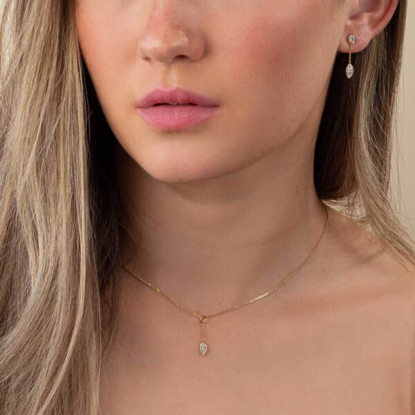 Model Wears Diamond Bezel Marquise Jen Earring Enhancer And Drop Pendant With Yellow Gold Anna Stud Earrings Cropped