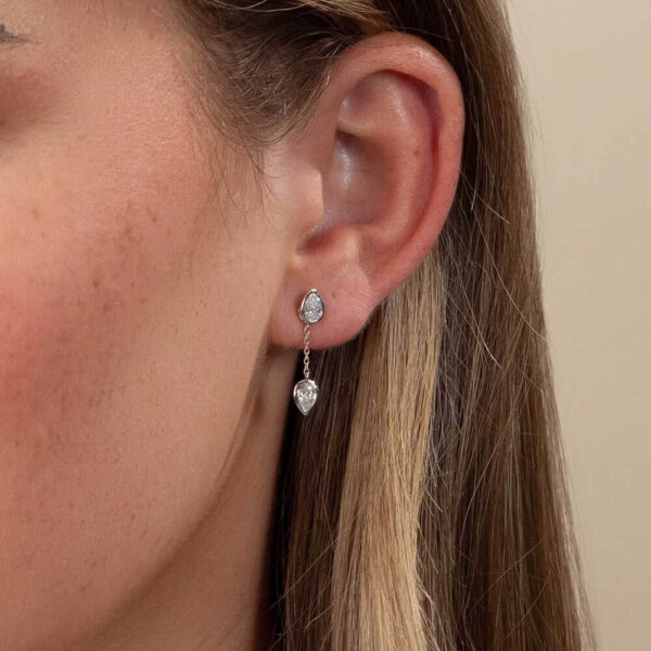 Model Wears Lab Grown Diamond Jen Pear Drop Earring Enhancer With Athena Bezel White Gold Studs Cropped