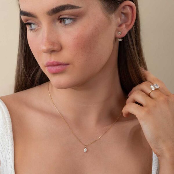 Model Wears Lab Grown Diamond Lou Marquise Medium Charm Pendant Luna Marquise Bezel Earring Enhancer Yellow Gold