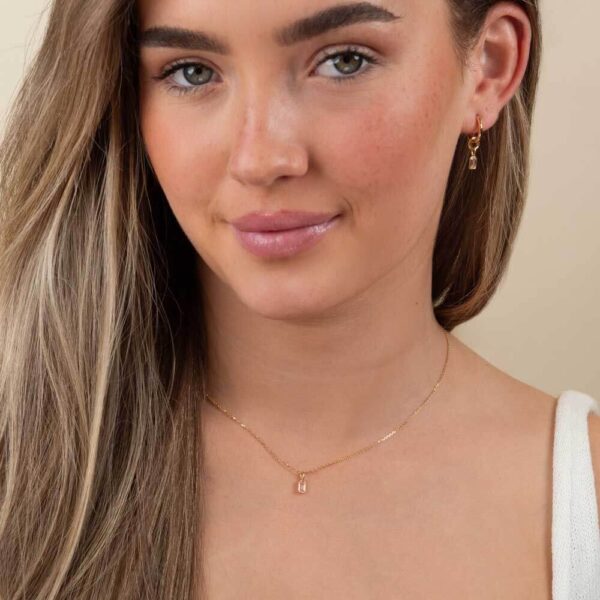 Model Wears Lab Grown Diamond Lou Pink Emerald Bezel Charm Pendant Blair Medium Yellow Gold Hoops