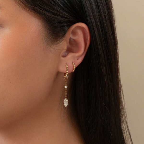 Model Wears Lab Grown Diamond Tate Marquise Pave Earring Enhancer With Hope Small Medium Ball Yellow Gold Hoops Cropped