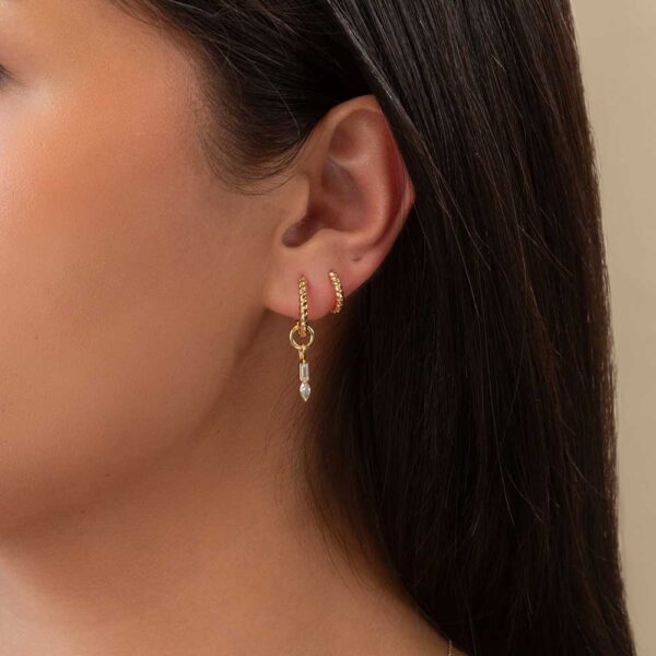 Model Wears Lab Grown Diamond Thea Baguette Pear Charm With Hannah Small Medium Yellow Gold Twisted Rope Hoops Cropped