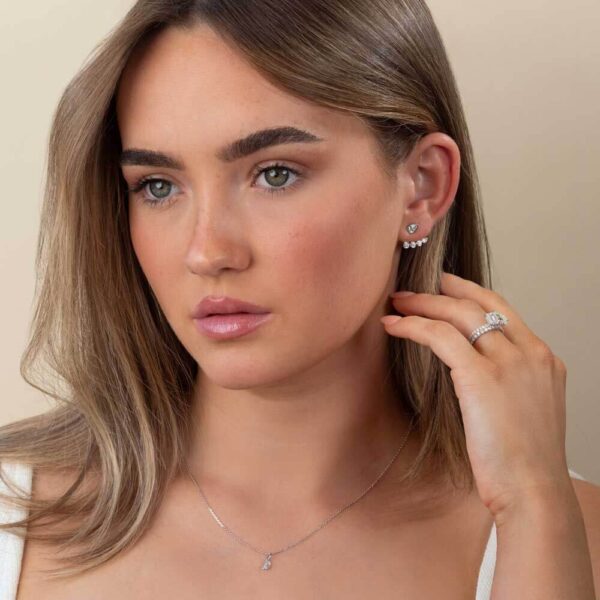 Model Wears White Gold Thalia Tapered Curved Bar Earring Enhancer Athena Pear Lab Grown Diamond Studs