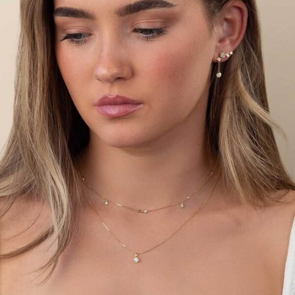 Model Wears Yellow Gold Gia Round Ear Climber Enhancer Lou Round Pendant Layered Cherie Mixed Diamond Necklace Cropped