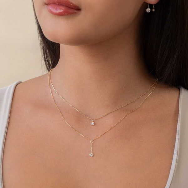 Model Wears Yellow Gold Jen Round Medium Bezel Drop Enhancer Lou Round Small Diamond Bezel Layered Pendant Cropped