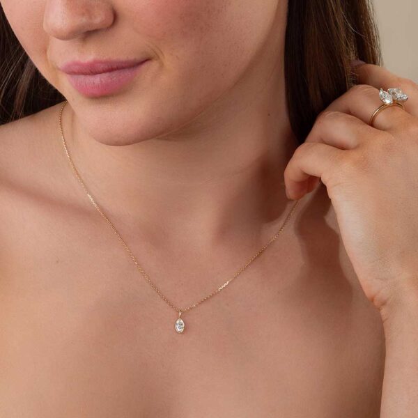 Model Wears Yellow Gold Lou Marquise Medium Bezel Diamond Pendant Cropped