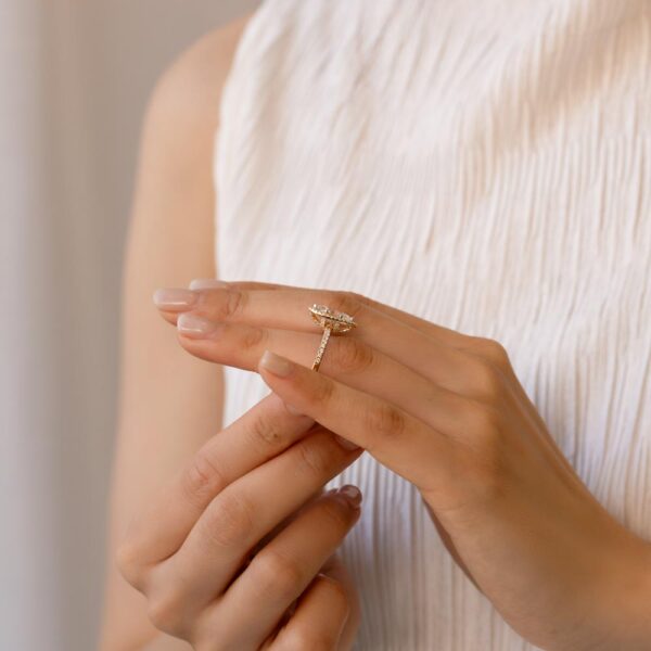 Model Wears Natasha Yellow Gold Lab Grown Diamond Marquise Halo Accent Basket Prong Set Half Band Ring