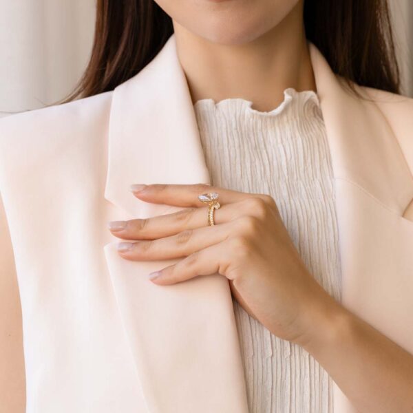 Model Wears Yulia Yellow Gold Lab Grown Diamond Pear Asymmetrical Double Band Bezel Pear Accent Ring